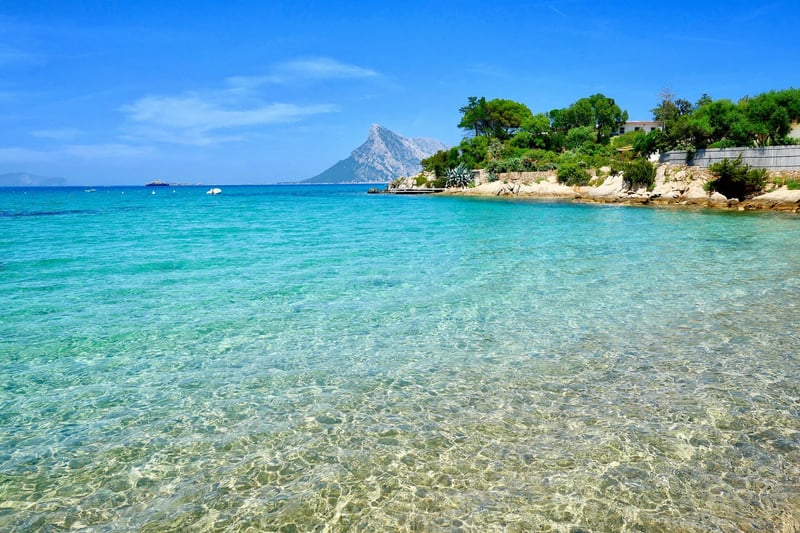Crystal clear turquoise waters of a beach in Blue Zone Sardinia, Italy 