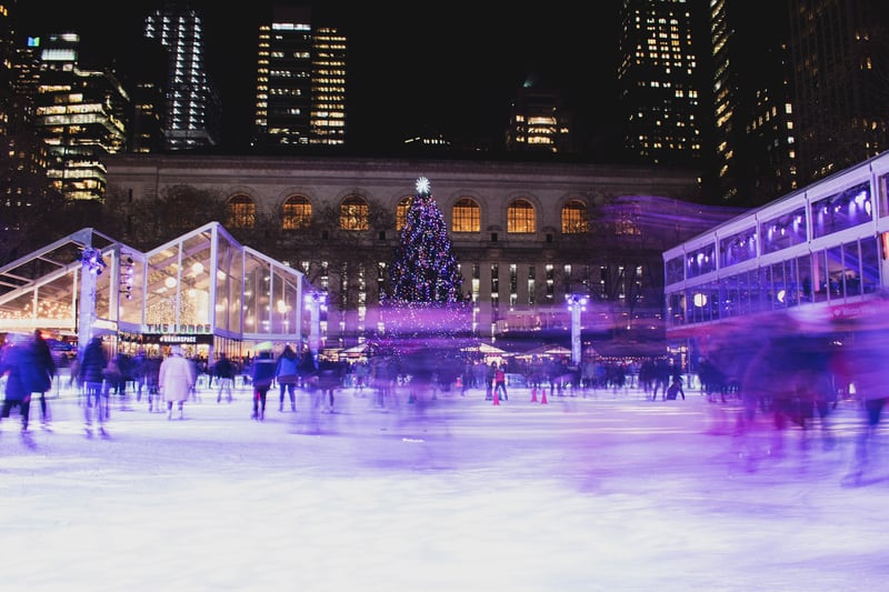 Ice skaing in front of the giant Christmas tree in Bryant Park, New York