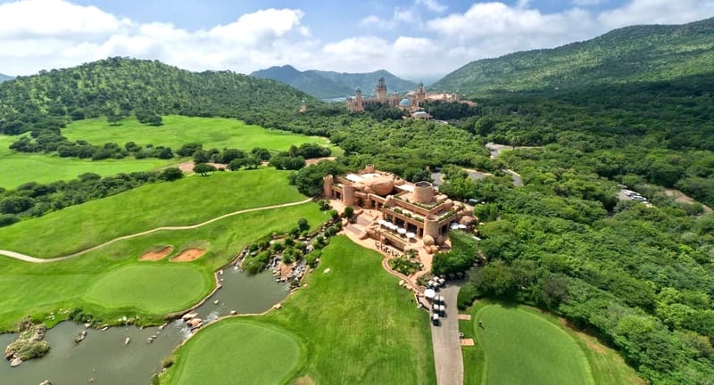 Aerial view of Suncity's The Lost City Golf Course and clubhouse with the palace in the background