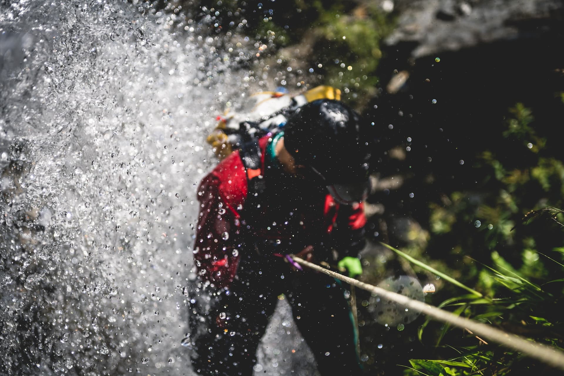 Man abseiling down a waterfall in San Gil, Colombia, South America's extreme sports capital