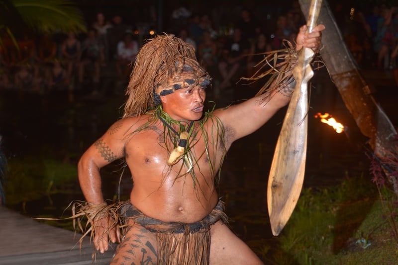 Polynesian Cook Islander man dance in cultural performance in Rarotonga, Cook Islands.