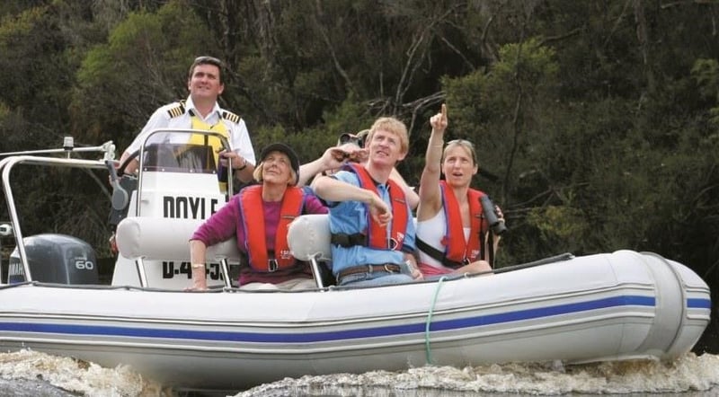 Mrtin and Mellisa, residents of Storylines residential cruise ship, on a boat tour in Birchs Creek Tasmania
