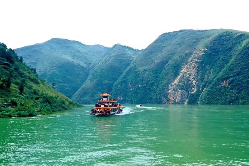 Yangtze River cruise boat heading into the steep gorges
