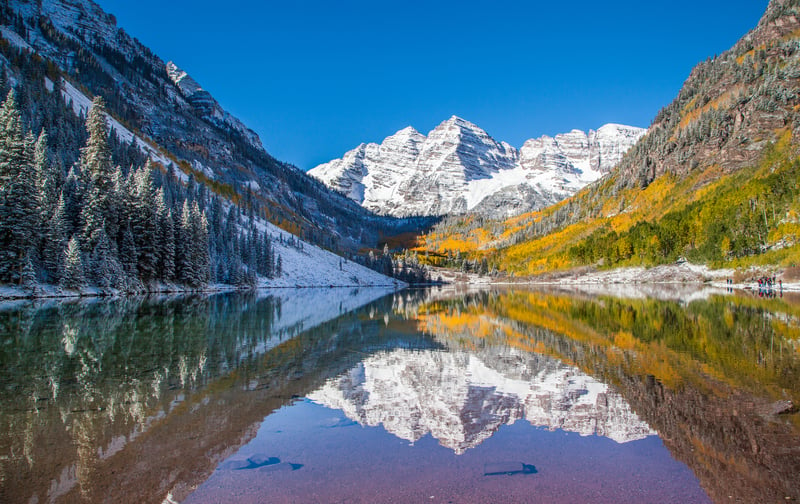 Maroon Bells in fall foliage after snow storm in Aspen, Colorado, the luxury ski playground of the rich and famous