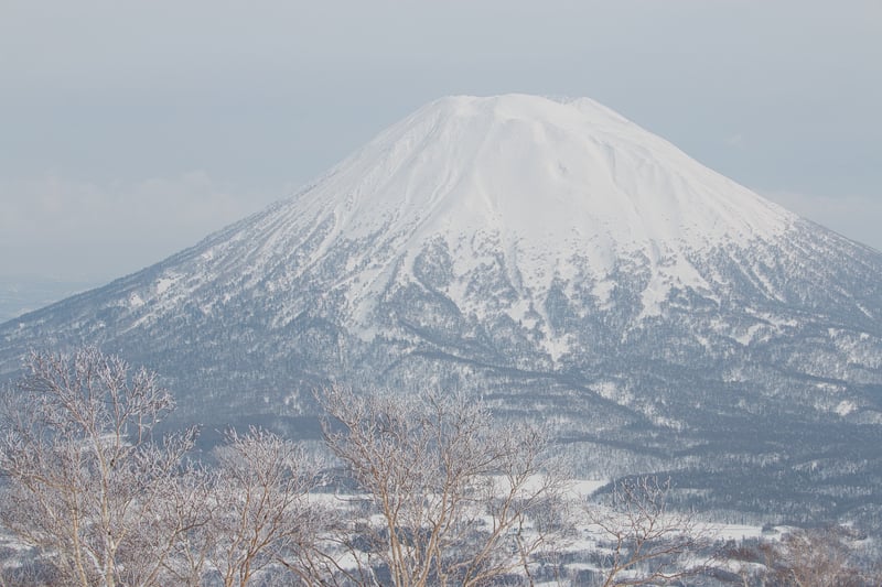View of the landmark volcano Mt Yotei in a popular tourist winter sports destination, Niseko, Hokkaido, Japan