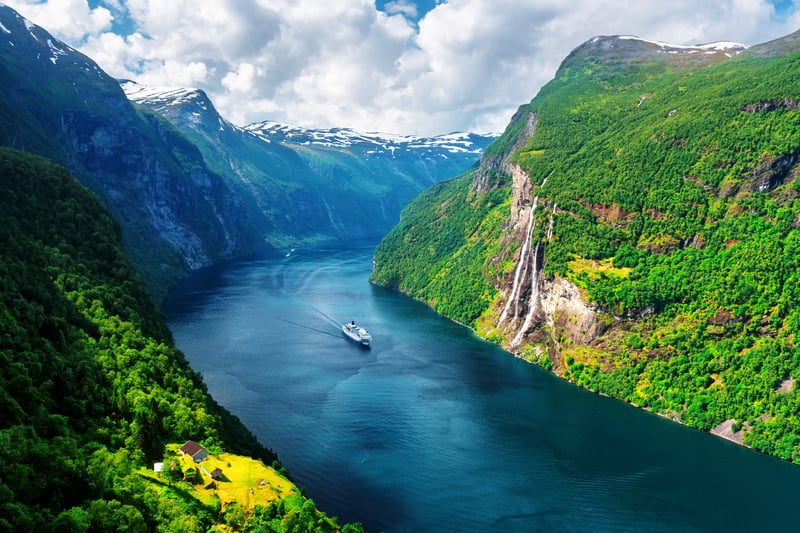 Cruise ship slow traveling through the Norwegian Fjords