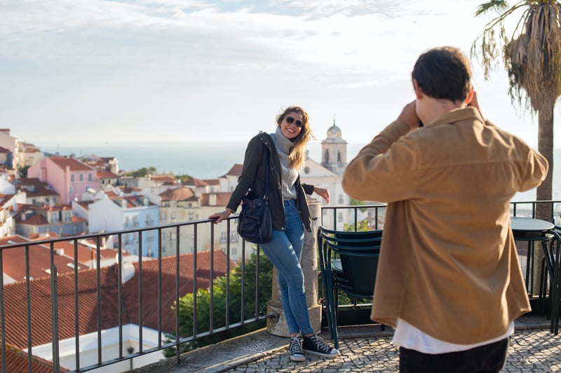 Solo woman traveler having her photo taken in Lisbon