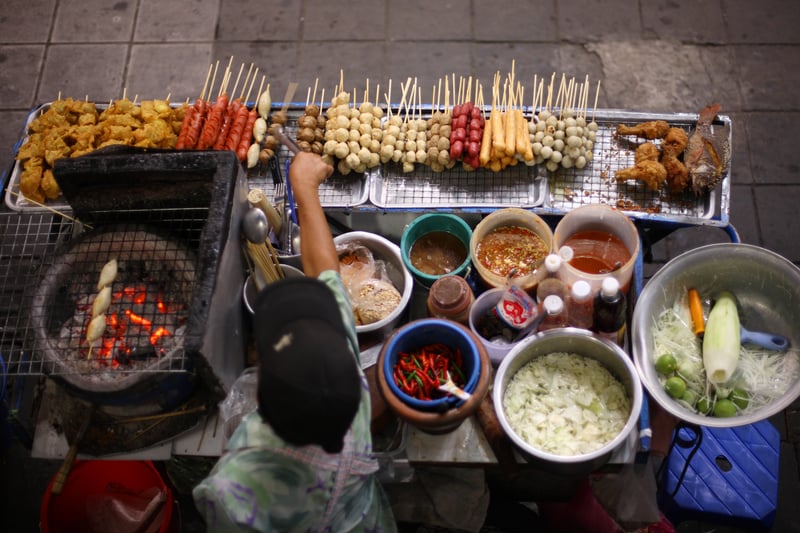 Top view of a street food vendor in Bangkok busy quarter Siam, some of the best street food of the world