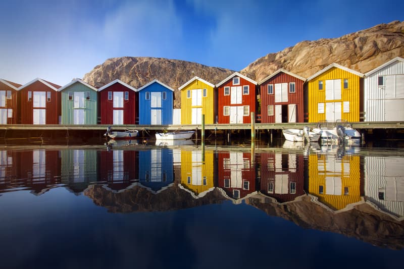 Row of colorful boat sheds in Sweden while visiting Scandinavia