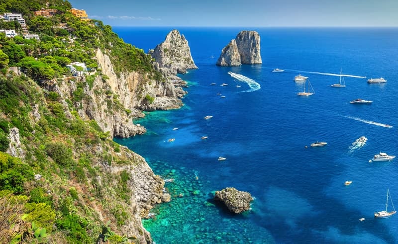 Visiting Europe: Coastal cliffs and azure waters of Capri Island, Italy