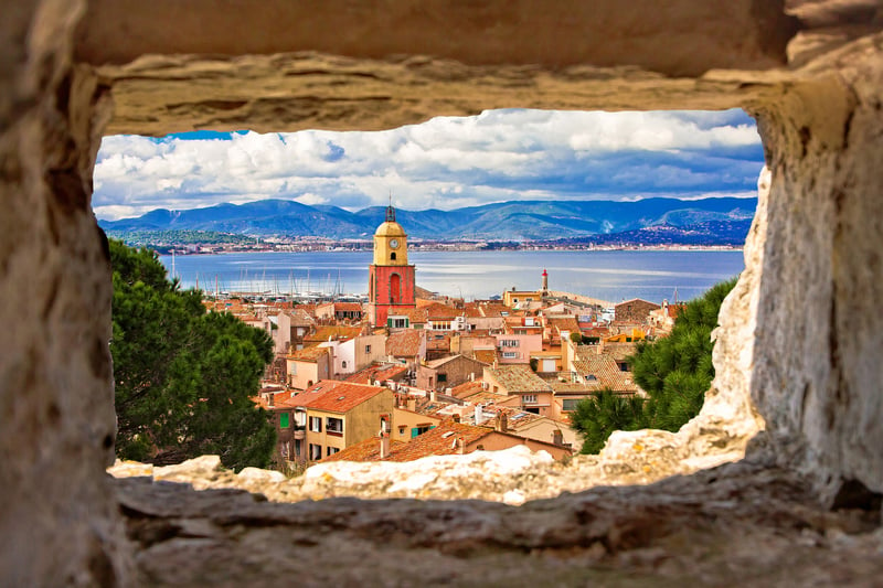 Visiting Europe: Saint Tropez village seen through a sandstone window