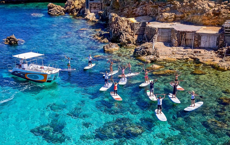 Paddle boarding with friends in Ibiza