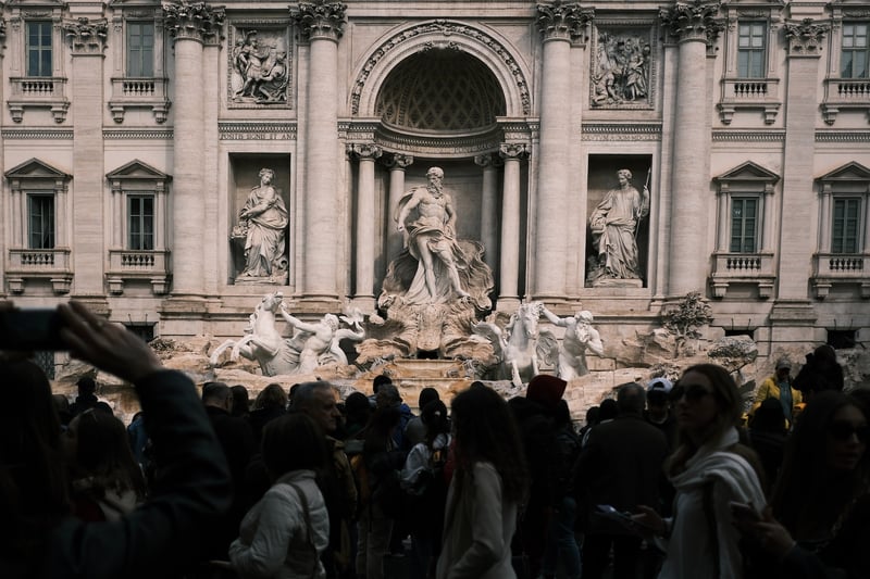 Tourists jampacked in front of Trevi in Rome Fountain 