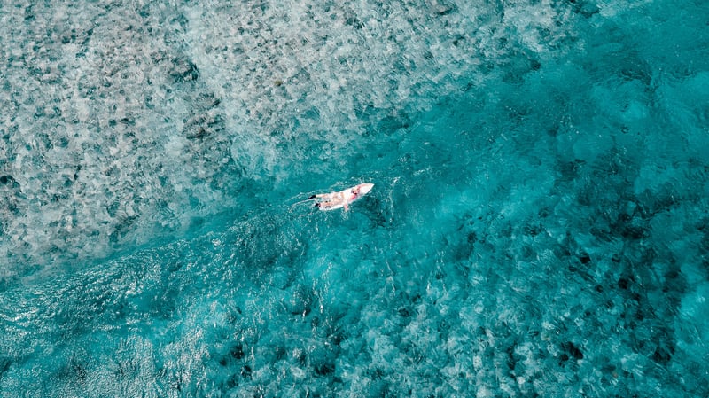Surfing in the Maldives is the best places for travel if you want to avoid the crowds